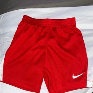 Nike Red Sports Shorts with White Logo